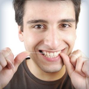 man-flossing-teeth